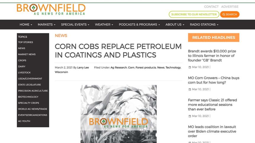 Photo of website image: Dr. Kevin Barnett discusses Pyran and new chemical products from agricultural products with Brownfield’s Larry Lee